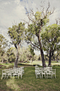 White mismatched wedding ceremony vintage chairs