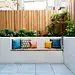Inspiration for a contemporary patio in London with fencing.