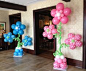 Super cute baby shower / gender reveal flower balloon columns at entrance.