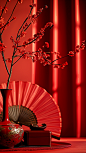 桌子上放着一把红色的折扇，旁边放着几颗红梅，背景比较模糊，好像在举行婚礼。中国的新年海报创造了一个独特的场景。春节气氛，喜庆，特写，高端，静物拍摄--ar 34-v 6 (13)