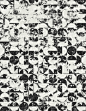 Washed out black and white rug whose design is made of circles and half circles