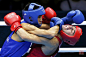 当地时间8月10日，2012年伦敦奥运会男子拳击52公斤级比赛，俄罗斯的Aloian(右)在对抗中被蒙古的Tugstsogt　Nyambayar的重拳击中。REUTERS/Damir　Sagolj
