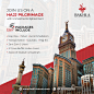 This may contain: an advertisement for a travel company in the middle of a large city with tall buildings and a clock tower