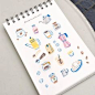 a notebook with drawings of kitchen items on it
