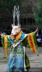 The monk in the deer’s dressed performs religious dance called Cham in Tibetan society. Local people’s really like to sit and catch the whole sessions of such dances. It happens once a year.