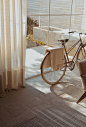 white bike near glass wall