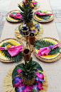 Style your own luau dinner table with supplies like our tiki tumblers, palm leaves, leis, and  luau fringe placemats. @partyplanits will show you her secrets to throwing the perfect luau party!