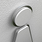   Amenity signage in matte white acrylic, featuring a brushed steel outline.  