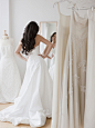 Mixed race woman trying on wedding dresses by Gable Denims on 500px