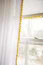 I can use white sheer curtains with pink or green pom pom ribbon and get those pull down shades in white like we had when we were little and do the same thing.: 
