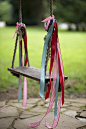 Add ribbon to a wooden swing.