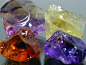 难得一见的宝石原石：水晶——后左：紫黄晶，后右：柠檬晶，前左：Madeira酒黄晶，前右：紫晶  产地：巴西 