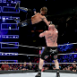 The WWE Champion soars through the air to level Lesnar with laser precision.