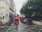 A busy London street seen through a rain-streaked window