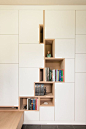 Filip Janssens - Laarne. white closet with wooden open shelves. shelving that resembles a a maze to me #artisticshelving armadiatura a parete con ante bianche e scaffali aperti che mi ricordano un labirinto.