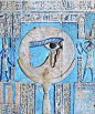 A painted relief of the sacred eye of Horus at the ancient Egyptian temple of the goddess Hathor at Dendera, Egypt.: 