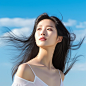 A Korean beauty with very white and delicate skin, enjoying the sun outdoors with a natural expression on her face, and long fine black hair cascading down. She is featured in a whitening skincare product advertisement poster with a blue sky and white clo