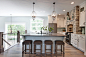 Country l-shaped medium tone wood floor and brown floor enclosed kitchen photo in Grand Rapids with recessed-panel cabinets, white cabinets, blue backsplash, stainless steel appliances, an island and gray countertops