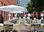 H10 Berlin Ku'damm Berlin, Germany City Dining Eat Modern building table outdoor chair restaurant outdoor structure meal interior design several