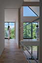 okuwada architects office fronts house in japan with angular shard-like façade