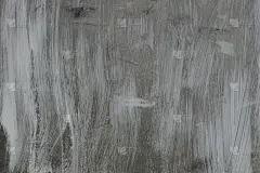 灰色的墙壁上有白色的油漆斑点