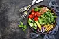 Lunch bowl with vegetables,beans and chicken meatLunch bowl with vegetables,beans and chicken meat on a dark slate,stone or metal background.Top view.