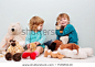 Happy preschool age children play with plush toys