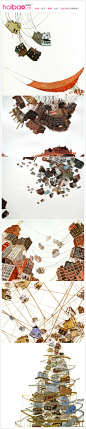 美国插画家Amy Casey的作品——“悬挂的城市”。对于作品中悬挂和颠倒的建筑物，她解释说这是对当今世界那种紧张状态的直接表达，借以启迪人们思考、探索自然灾害的毁灭力量，同时寻求解决之道。