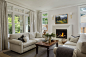 Inspiration for a mid-sized transitional formal and open concept medium tone wood floor and gray floor living room remodel in San Francisco with white walls, a standard fireplace, a plaster fireplace and no tv