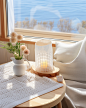 gvnfc_There_is_a_table_near_the_window_with_a_white_tablecloth__a1e40990-f84d-46d9-969a-a4ec52ab8d72