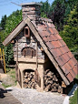 The roof protects the oven and wood supply, but does nothing for someone standing in rain to put bread, pizza, etc. into the ove