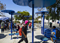 Redesigned bus shelters in Santa Monica comprising blue discs on stilts.: 