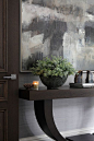 espresso brown wood console table | foyer design ideas | home staging ideas | blue white grey taupe abstract paint | nickel square door handle | stained interior doors | door moulding | grass cloth wallpaper