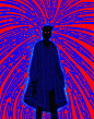 Photo by James Fenner on March 14, 2023. May be pop art of 1 person, overcoat, sparkler and fireworks.