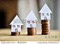 Mortgage concept by money house from the coins