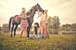 Photograph Caucasian women petting horse in rural field by Gable Denims on 500px