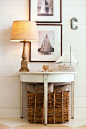 Here's a great example of decorating a beach cottage with antique pieces and old nautical photos.: 