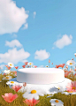 a white cake sitting on top of a lush green field filled with flowers and daisies