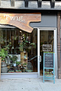 Very cute store front- Twig Terrariums Shop . Love the live edge wood used on the sign.