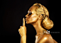 Secrecy. Bodyart. Golden Woman showing Silence Sign. Hush!