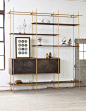 The Collector's Shelving is a fully adjustable system of shelves and credenzas, designed by the high-end American fabricator Amuneal.