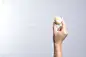 Hand holding Chinese pastry moon cake