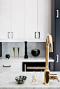 Black white kitchen, brass faucet: 