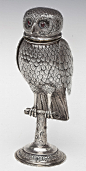  Continental Sterling Silver Owl Form Vessel

描述：DESCRIPTION: A Continental silver owl of realistic form with hinged head with glass eyes and articulated wings on a naturalistic perch with round scrolled base. Illegible hallmark to base edge. Tested sterl