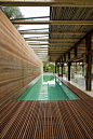 Indoor lap pool with rammed earth wall. Silvio Rech and Lesley Carstens Architects