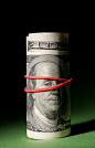 stock.xchng - Tightened 100 dollar roll. (stock photo by hoboton) [id: 1377964]