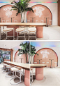 This modern ice cream parlor features four main arches that are accented by multicolored led lighting slowly alternate hues, creating perpetual movement and framing the neon signs. #IceCreamParlor #Arches #RetailDesign #InteriorDesign