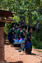 A female greeter performing a skirt swirl while heading to a Yi funeral at Mi Shi Qing Mo in Daliangshan.
