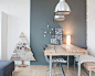 Danish light wood floor dining room photo in Amsterdam with gray walls