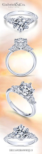 Gabriel & Co. - Voted #1 Most Preferred Bridal Brand. This three (3) stone engagement ring featuring a round cut center stone and two accent diamonds is reminiscent of a twinkling starburst.